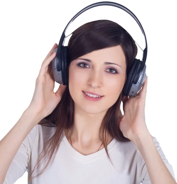Jovem mulher em fones de ouvido ouvir música — Fotografia de Stock