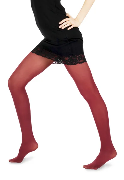 Mulher encantadora em meias vermelhas — Fotografia de Stock