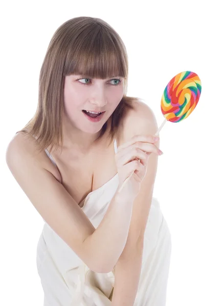 Яркая фотография голодной блондинки с цветным леденцом — стоковое фото