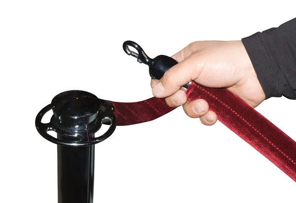 Human hand open red velvet rope — Stock Photo, Image