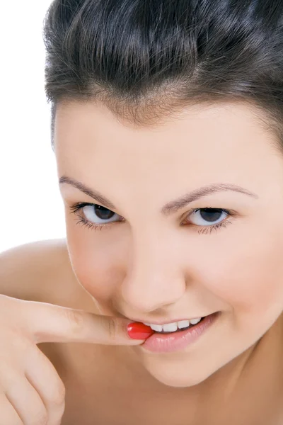 Female face with finger in mouth — Stock Photo, Image