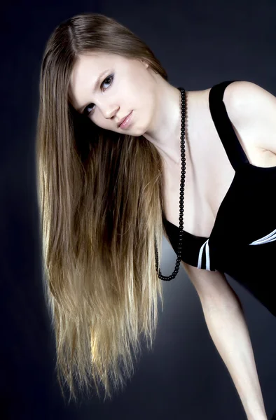 Lovely blonde over black background — Stock Photo, Image