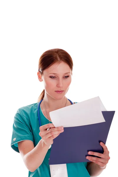 Medic looking at her report — Stock Photo, Image