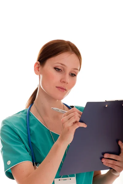 Medic looking at her report Royalty Free Stock Images