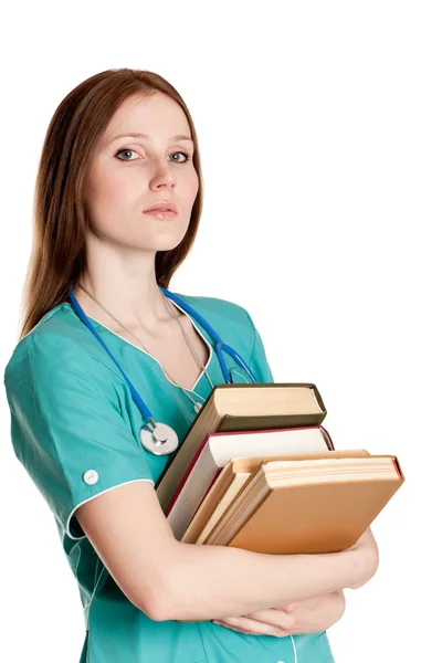 Portrét ženského lékaře s knihami — Stock fotografie