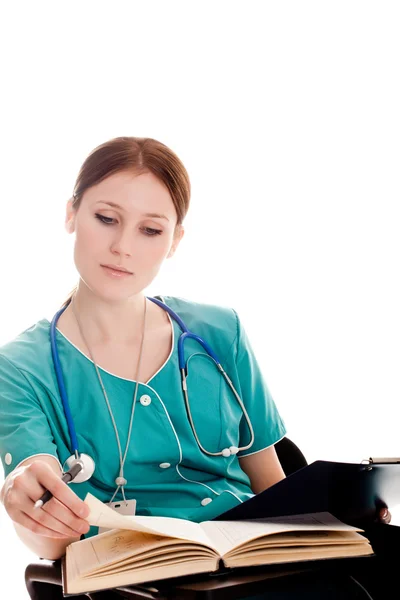 Female doctor in the green uniform — Stock Photo, Image