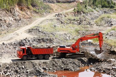 Dump Truck and Excavator in a Quarry clipart