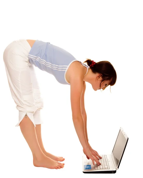Flexible young girl with laptop over white — Stock Photo, Image