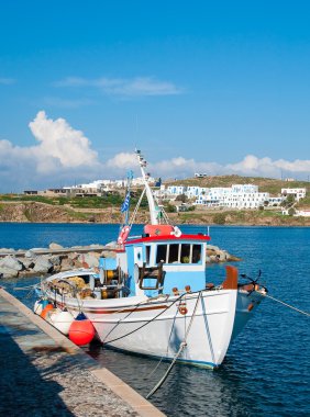 Fishing boat near the pier after the sea clipart