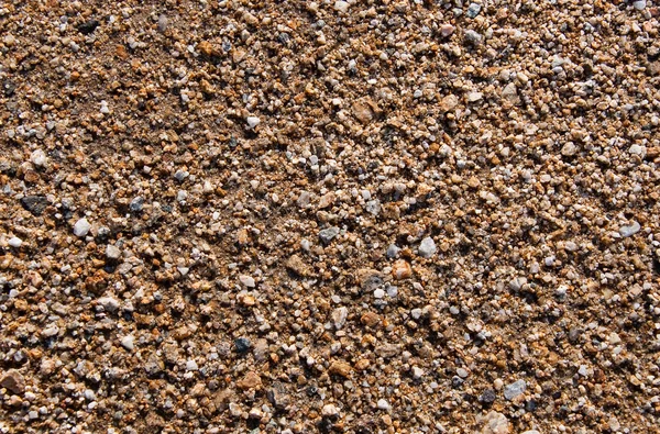 Marine sand with colored stones — Stock Photo, Image