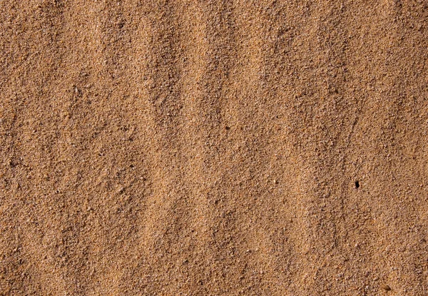 Желтый волнистый морской песок — стоковое фото