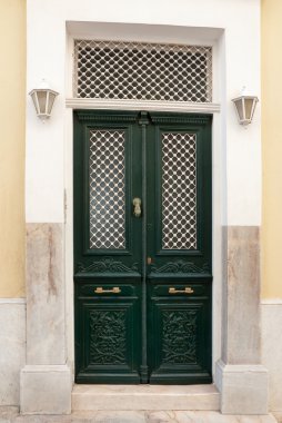 Classic green street door with lights clipart