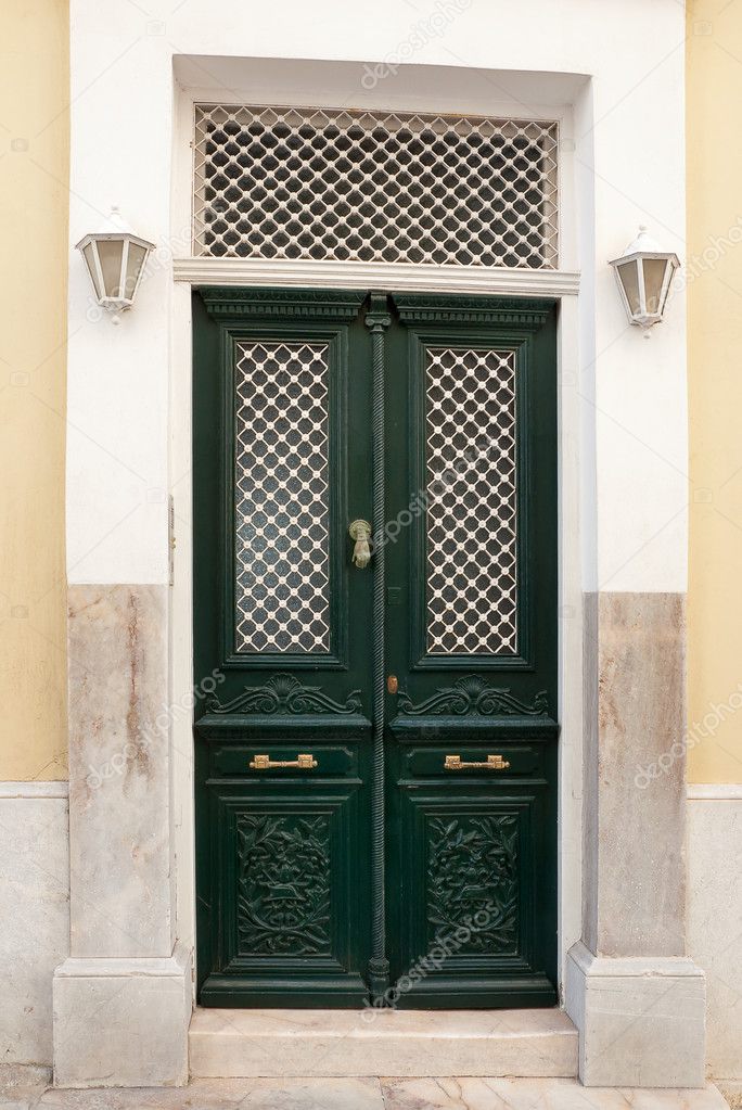 Classic green street door with lights