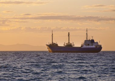 Sunrise at sea and the fishing vessel clipart