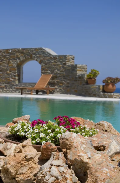 Stone flower beds around the pool