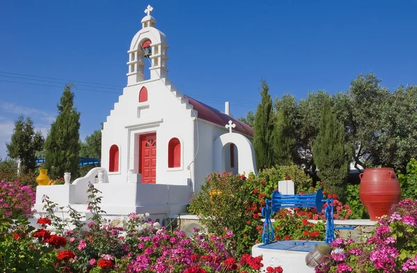 The Greek church is with flowers — Stock Photo, Image