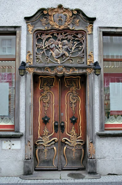 stock image Richly decorated old door in baroque style.