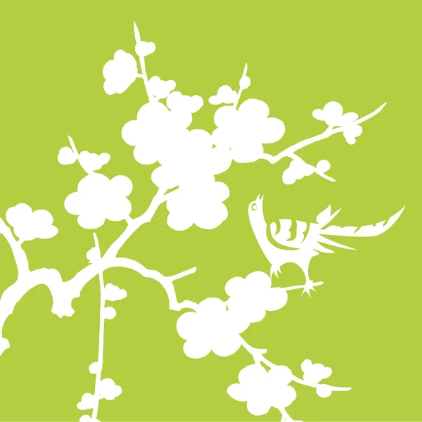 Белая птица с цветами на зеленом — стоковое фото