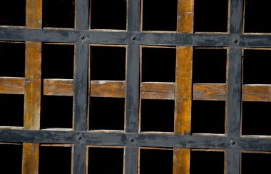 Wooden lattice on a black background clipart