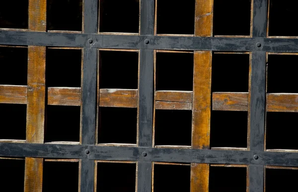 Wooden lattice on a black background — Stock Photo, Image