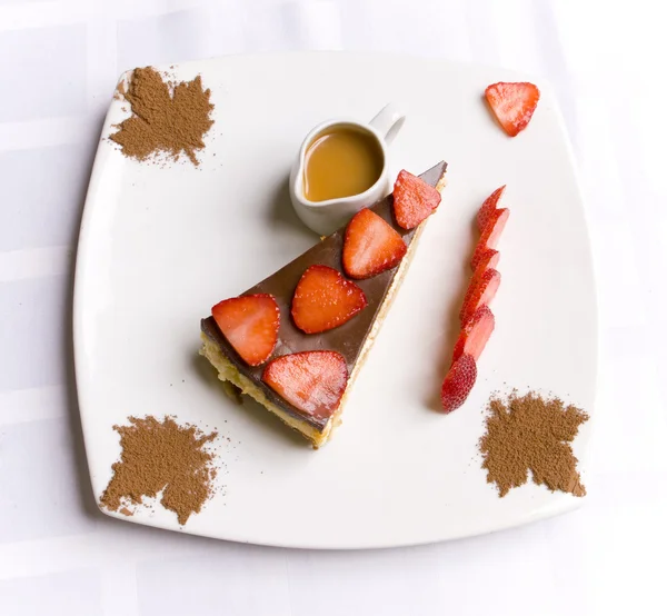 Chocolate pie decorated with strawberry and ser — Stock Photo, Image