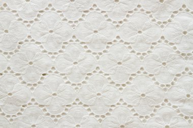 Background of white embroidered fabrics clipart