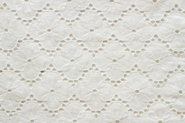 Fundo de tecidos brancos bordados — Fotografia de Stock