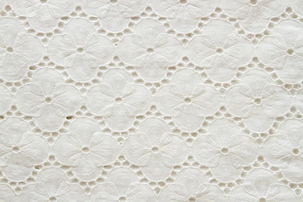 Background of white embroidered fabrics — Stock Photo, Image