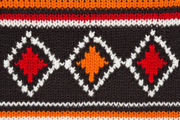 Knit sweater texture. orange, black and white threads. ornament — Stock Photo, Image