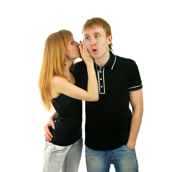 Couple whispering isolated background Stock Photo