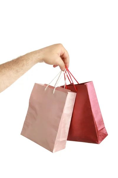 Paper bags in male hand — Stock Photo, Image