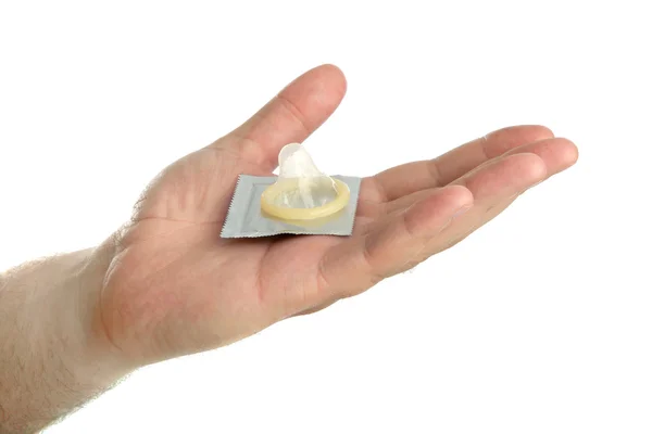 Man's hand with condom — Stock Photo, Image
