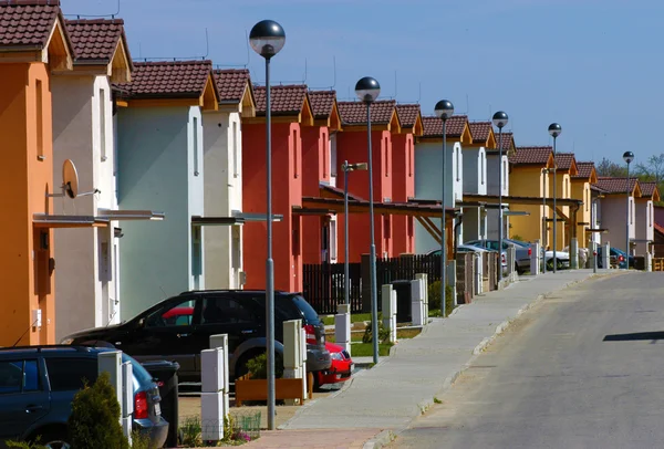 stock image Raw of white red and yellow houses