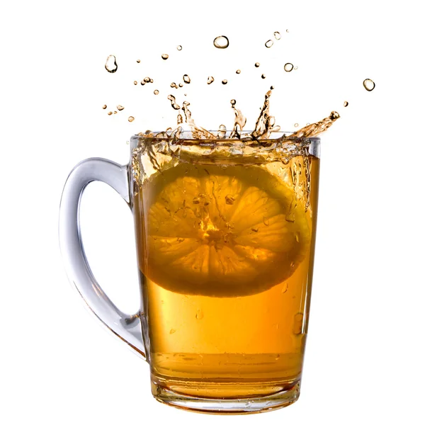 Lemon dropped into tea cup — Stock Photo, Image