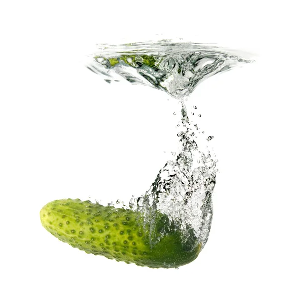 Green cucumber dropped into water — Stock Photo, Image