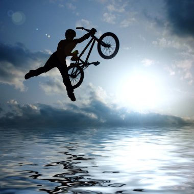 Silhouette of boy with bicycle clipart