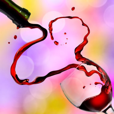 Heart from pouring red wine in goblet clipart