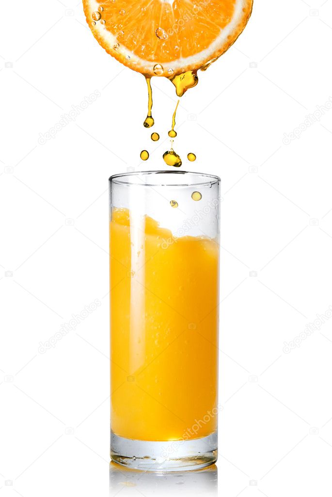 Pouring orange juice from orange