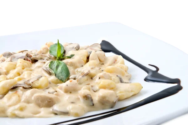 stock image Meat under white sauce on the plate