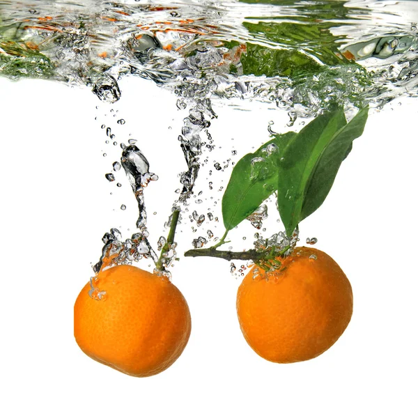 Tangerine dropped into water with bubbles — Stock Photo, Image
