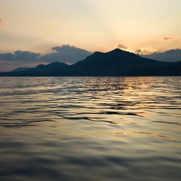 Stock image Landscape with sea and mountains on sunset