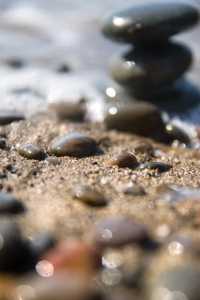 Stones and water wave — Stock Photo, Image