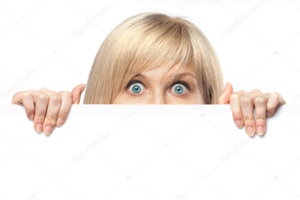 Surprised young woman holding white empty paper