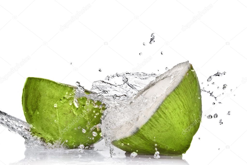 Green coconut with water splash