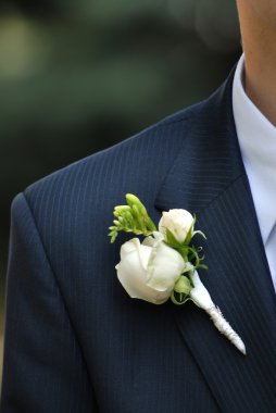 Wedding buttonhole with rose on mans suite clipart