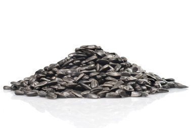 Pile of black sunflower seeds isolated on a white background clipart