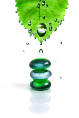 Balancing spa shiny stones with leaf and water drops isolated on white clipart