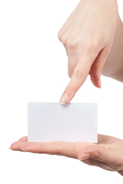 Womans hands holding and pointing empty visiting card — Stock Photo, Image