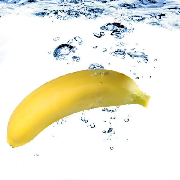 Banana dropped into water — Stock Photo, Image