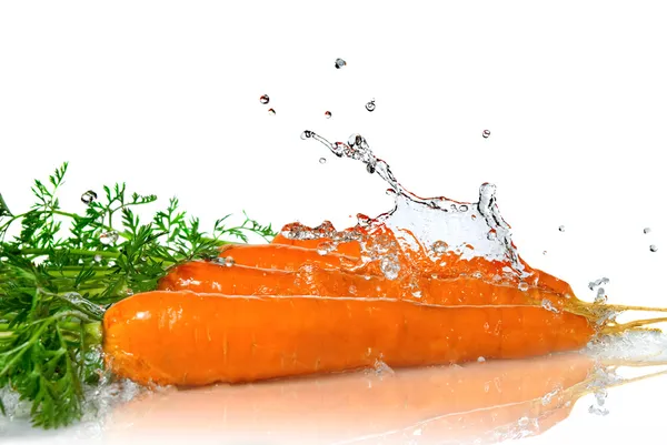 Sladké vody stříkající na mrkev — Stock fotografie